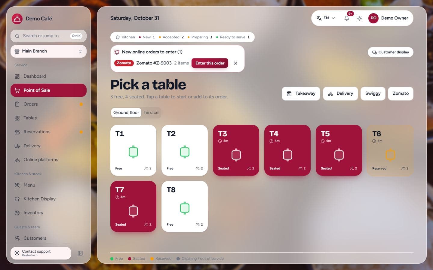 RestroTech point of sale with table grid, takeaway, delivery, Swiggy and Zomato buttons and an online order alert